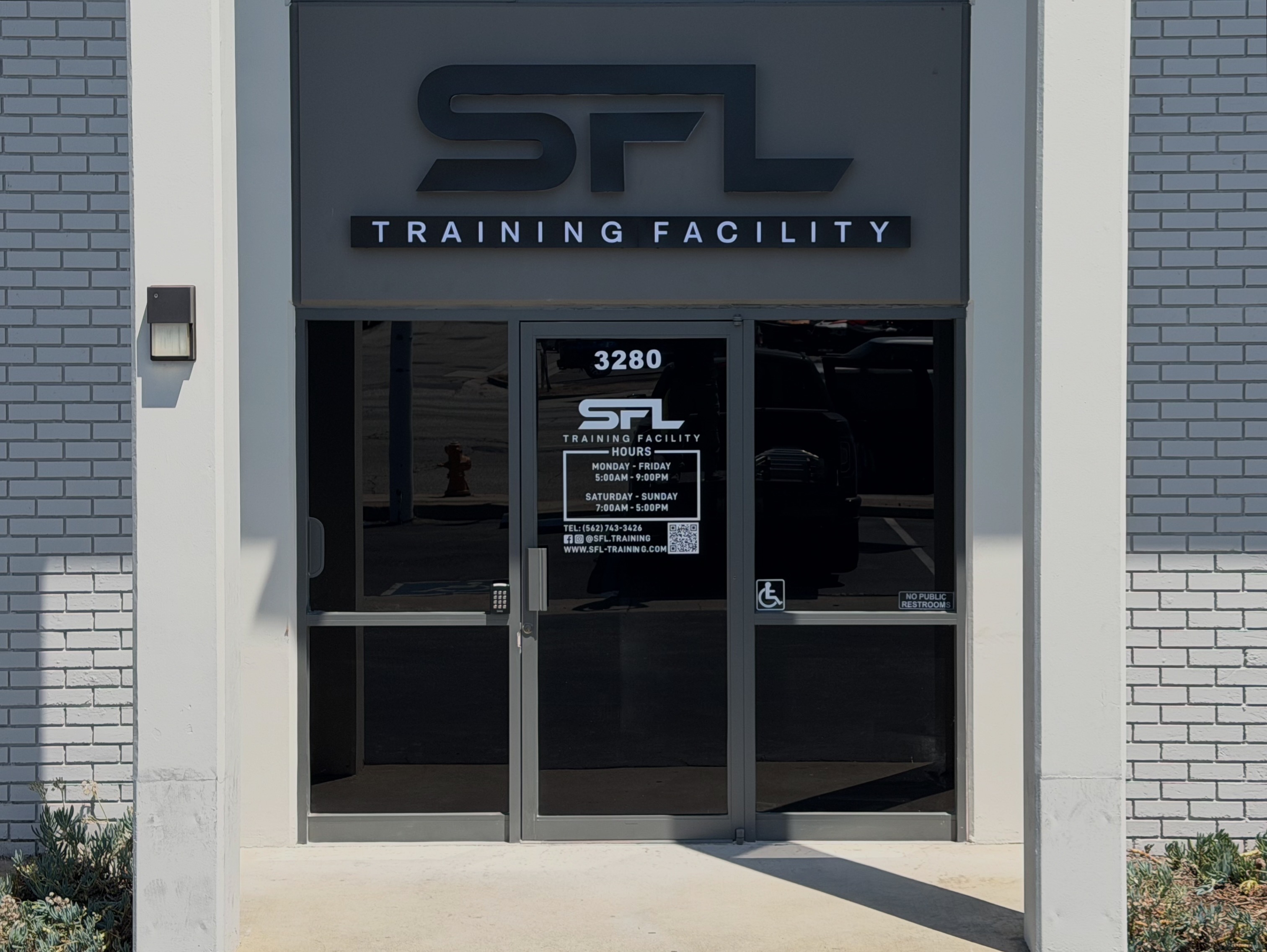 SFL Training Facility dimensional storefront sign and glass entry door graphics